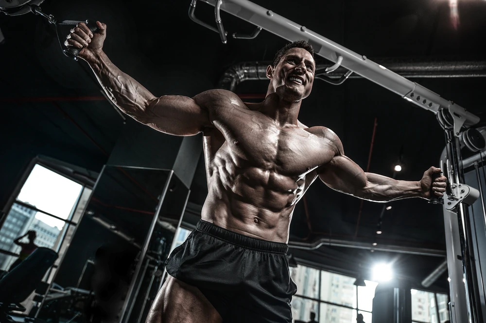 Brutal Handsome Caucasian Bodybuilder Working Out Training In The Gym