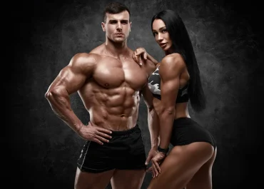 Sporty Couple Showing Muscles On Wall Background Muscular Man